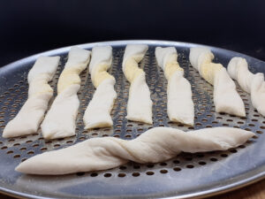 Twisting the Dough unto the pan