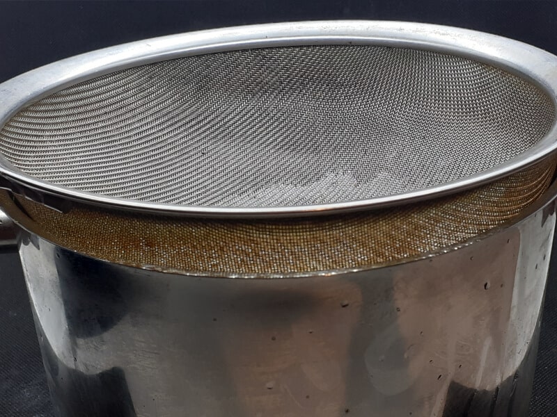 Pot Fitted with a Sieve to strain Hot Oil