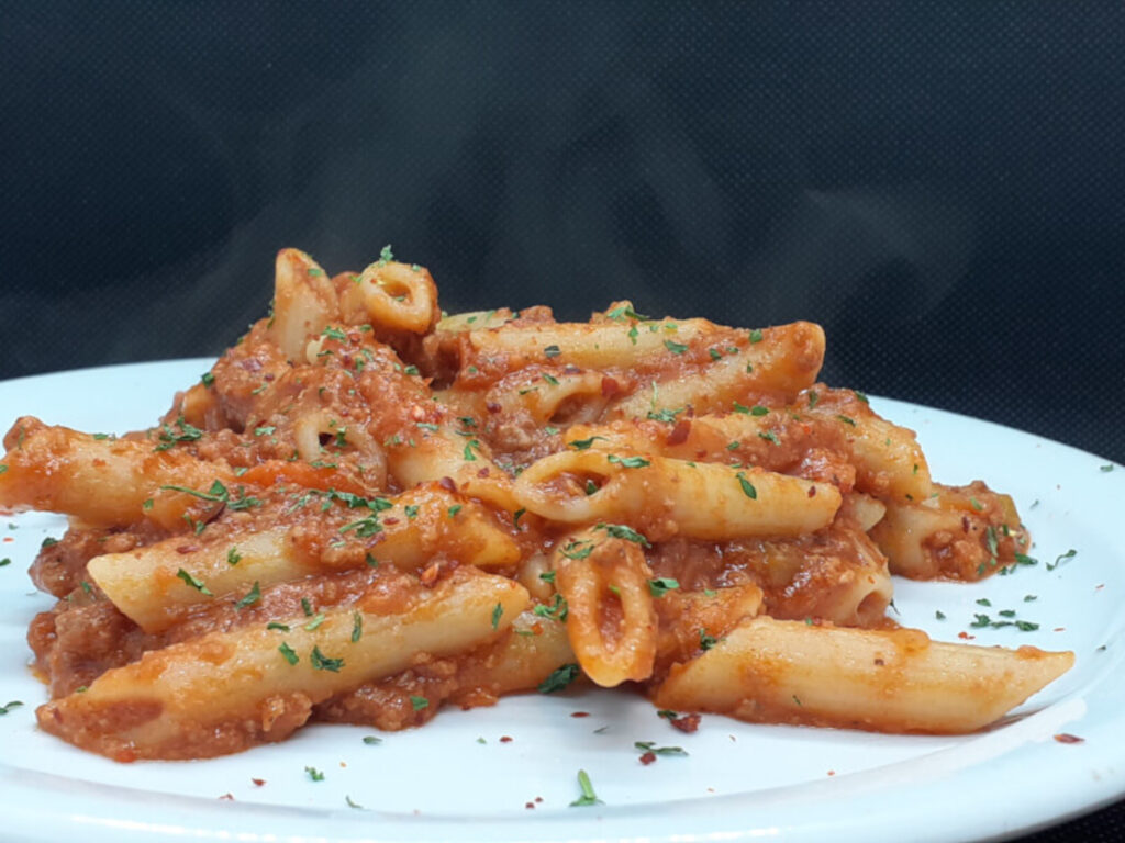 Plate of Penne Bolognese with added Passata