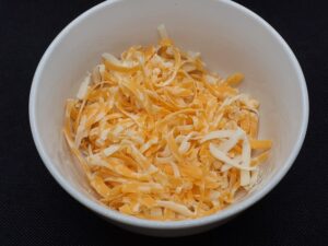 Shredded Marble Cheese and one Babybel Cheese